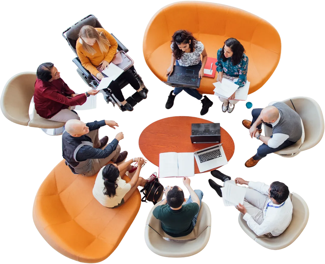 A team working together around a table, seen from above